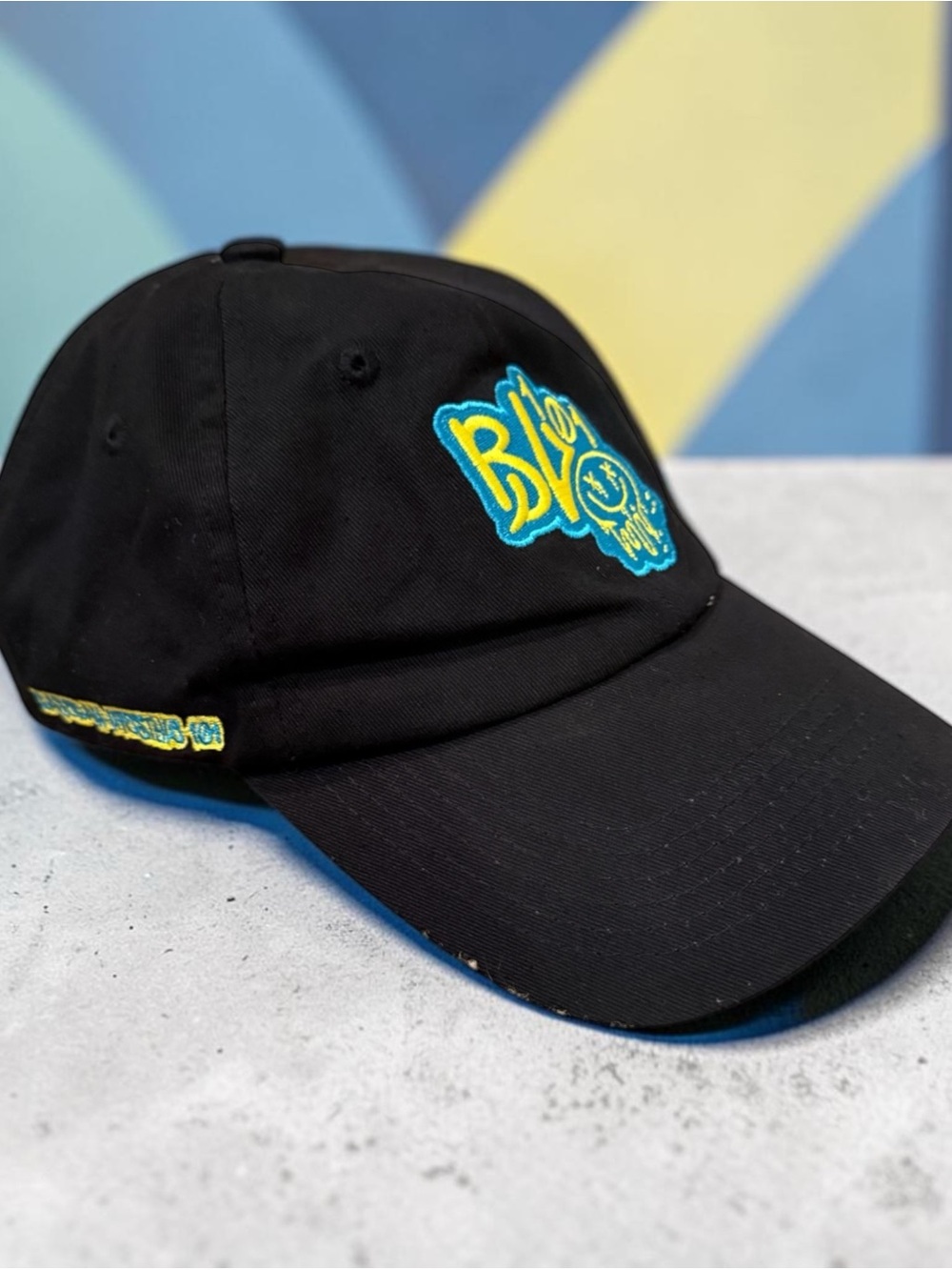 Baseball Lifestyle 101 black hat with yellow and blue graffiti face!